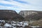 Turda Gorge offers a karst landscape of rare wild: high cliffs and steep, sharp ridges, towers of stone, rocky valleys, debris, ar