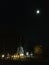 Turin city by night, Mole Antonelliana and the moon