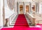 Turin, Italy - Circa January 2022: red carpet in Royal Palace - luxury elegant marble stairway