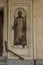 Turin, Italy, June 27, 2019: Statue of don Filippo Rinaldi in the wall alcove of one of the buildings in Turin
