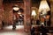TURIN, ITALY - NOVEMBER 3, 2018: Ogr, Officine Grandi Riparazioni cafe interior with people, evening in Italy