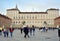 Turin, Piedmont, Italy-04/21/2019-Tourists walk in the square Castello in front of Royal Palace