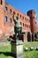 Turin, Piedmont, Italy the Archaelogical Park of Romans ruins and statue of Caesar Augustus with Torri Palatine in background