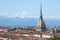 Turin skyline view, Mole Antonelliana tower and hot air balloon in a sunny day in Italy