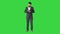 Turk business man texting on his phone on a Green Screen, Chroma Key.