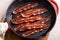 Turkey bacon cooked in a cast iron pan