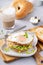 Turkey bagel breakfast sandwich with lettuce and fried egg