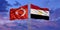 Turkey and Egypt flag waving in the wind against white cloudy blue sky together. Diplomacy concept, international relations