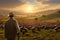 Turkey farmer caring for a flock of turkeys in a