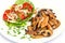 Turkey hen strips and button mushrooms with tomato salad