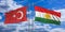 Turkey and Kurdistan flags wave opposite under a blue sky with many white clouds. 3d illustration