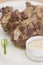 Turkey necks,  served with horseradish puree,  placed on white plate,  light background,  isolated