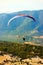 Turkey, Oludeniz - June 23, 2015: The flight of paragliders in the highlands. Paragliding. Taking photos from a height.