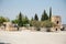 Turkey. Pamukkale Park and ancient Hierapolis. Cypresses, acacias and ancient stones