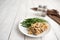 Turkey Stroganoff on white wood table with green beans