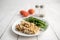 Turkey Stroganoff on white wood table with green beans