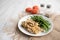 Turkey Stroganoff on white wood table with green beans