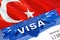 Turkey Visa in passport. USA immigration Visa for Turkey citizens focusing on word VISA. Travel Turkey visa in national