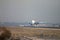 Turkish Airlines jet airliner approach to land at Madrid airport runway, seen from behind