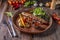 Turkish and Arabic Traditional Ramadan mix kebab plate, Kebab lamb and beef with baked vegetables, mushrooms and tomato sauce,