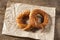 Turkish bagel simit on packing paper and wooden table