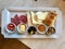 Turkish Breakfast Plate with Cheese, Various Jams, Salami, Borek and Dried Fruits.