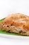 Turkish burek with meat on a green plate