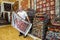 A Turkish carpet seller displays a rug in a shop in the old town of Kaleici in Antalya.