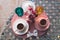 Turkish coffee cups served outside with water flowers and delight dessert in romantic setup on glass table