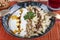 Turkish cuisine, Samsun style ravioli. Turkish ravioli manti preparation with meat, yoghurt, butter and red pepper. MantÄ± concept