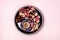 Turkish Delight Turkish Coffee Date Fruit and Garnet on Black Round Tray Pink Background Top View Ramadan