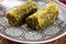 Turkish Dessert fÄ±stÄ±k ezmesi baklava with pistachio on wooden