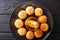 Turkish dessert kataifi with honey close-up on a plate. horizontal top view