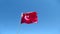 Turkish flag flies in the wind on flagpole against the blue sky. The red and white flag of the country of Turkey.