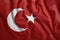 The Turkish flag is flying in the wind. Colorful, national flag of Turkey. Patriotism, a patriotic symbol