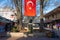 Turkish flag and statue of Ibrahim Muteferrika in Sahaflar Carsisi