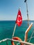 Turkish flag at teh stern of a boat