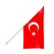 Turkish flag on wall mounted angled flagpole isolated on white background. Republic of Turkiye Turkey hanging flag on pole
