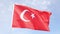 Turkish flag waving against the blue sky