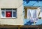 Turkish flag in the window, near the balcony dries linen. Typical house in a poor quarter of Istanbul