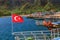 Turkish flags waving on tourist boats in the magnificent Adrasan.