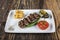 Turkish Food Meatball Kofte. Kofta with Tomatoes and Onion in Plate Portion. Grilled Kofte. Spicy meatballs Kebab or Kebap healthy