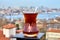 Turkish glass with tea on background of cityscape of Istanbul