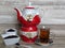 Turkish, Iranian, Persian black tea in glass. Chai. Black tea powder in two white porcelain bowl. Red Iranian porcelain teapot.