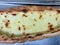 Turkish Karadeniz Pide with Melted Cheese on tray. turkish pizza concept