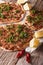 Turkish lahmacun closeup on a wooden table. vertical