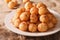 Turkish lokma donuts with honey and cinnamon close-up. horizontal