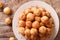 Turkish lokma donuts with honey and cinnamon close-up. horizontal top view