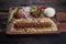 Turkish lula lamb or beef kebab with rice and vegetables on rustic wooden table