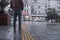 Turkish man standing near rainy street while raining heavily outside and rain drops all around in Taksim territory